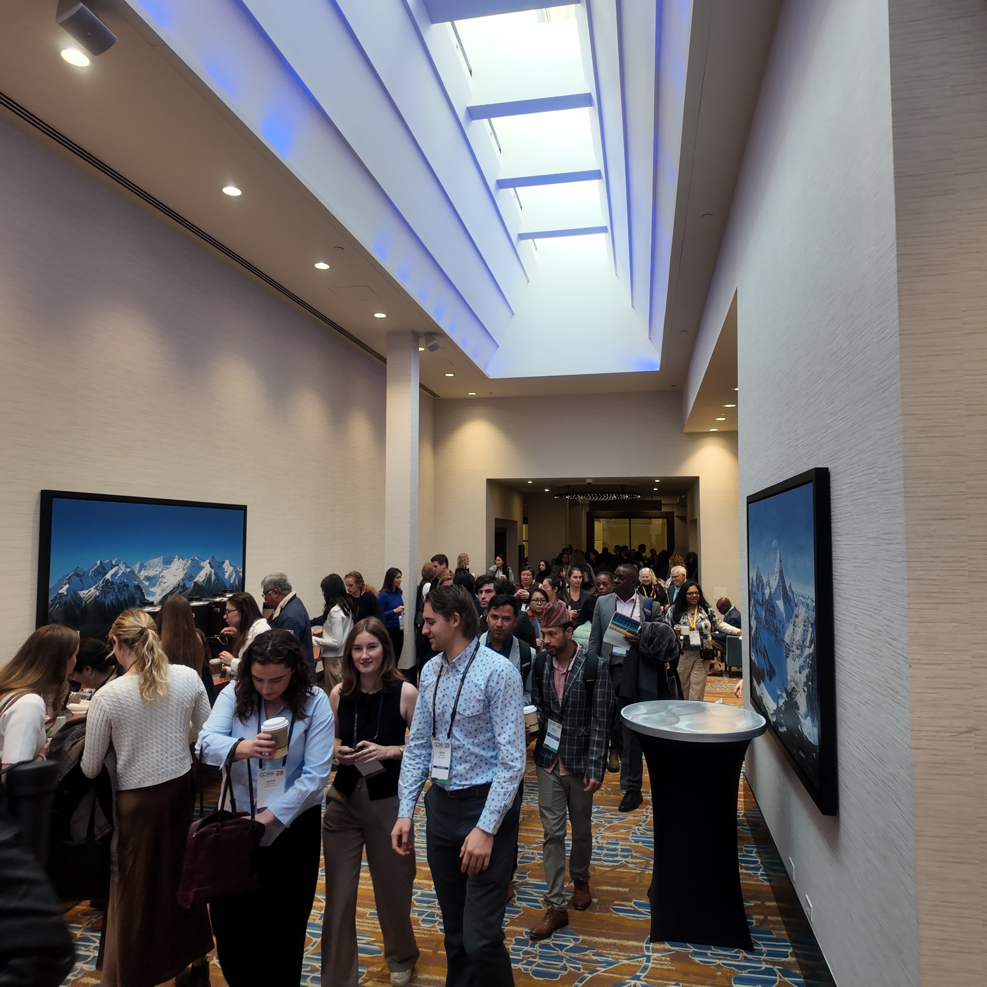 Attendees networking in a conference hallway